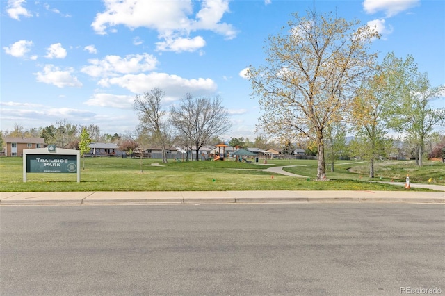 view of road with curbs, sidewalks, and a residential view