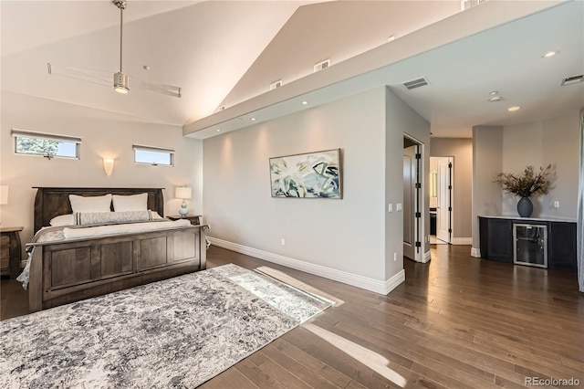 bedroom with lofted ceiling, dark hardwood / wood-style floors, and beverage cooler