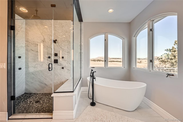 bathroom with tile patterned flooring and independent shower and bath