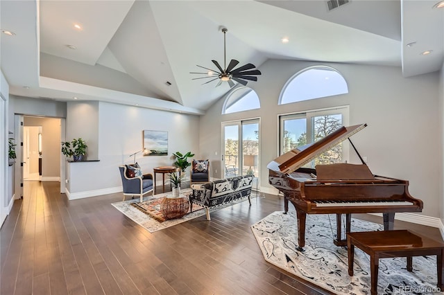 miscellaneous room with ceiling fan, dark wood-type flooring, and high vaulted ceiling