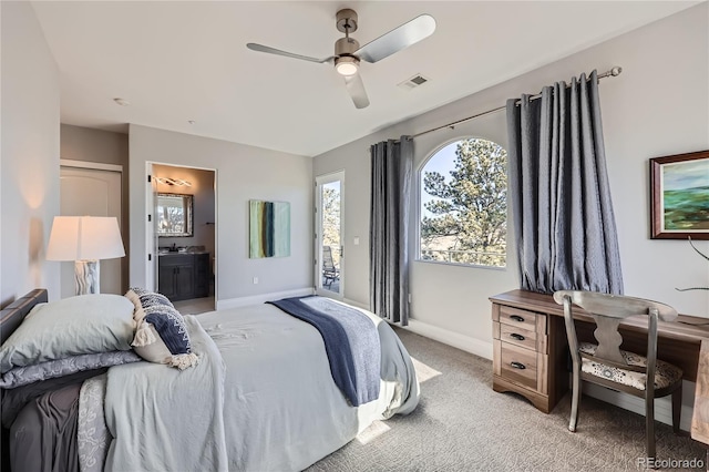 carpeted bedroom with ceiling fan and connected bathroom