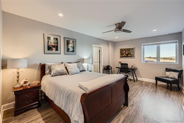 bedroom with wood-type flooring and ceiling fan