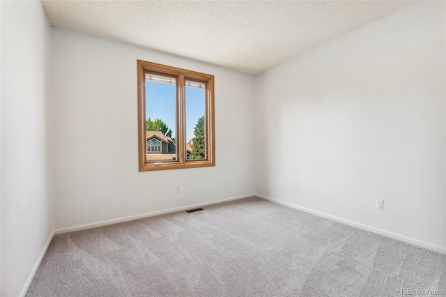 11932 W 56th Cir, Arvada, CO 80002 - unfurnished room with carpet floors and a textured ceiling