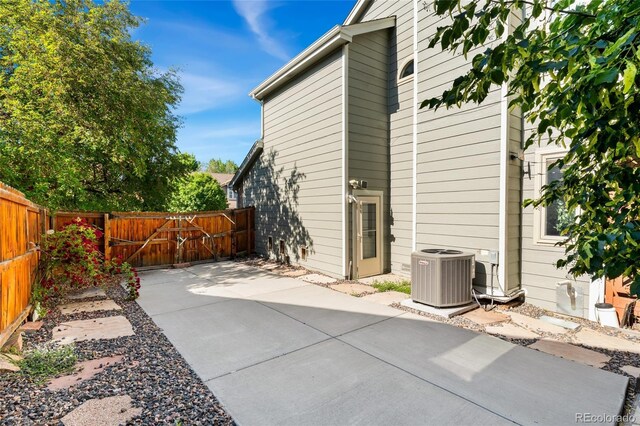 11932 W 56th Cir, Arvada, CO 80002 - rear view of house with a patio and a fenced backyard