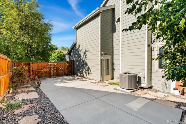 11932 W 56th Cir, Arvada, CO 80002 - rear view of house with a patio and a fenced backyard