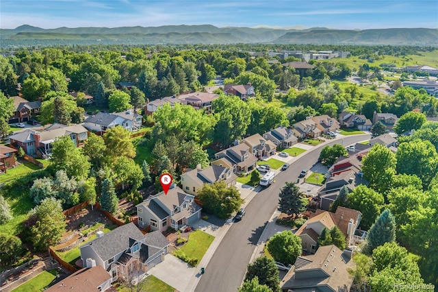 11932 W 56th Cir, Arvada, CO 80002 - aerial overview of property's location featuring mountains and nearby suburban area