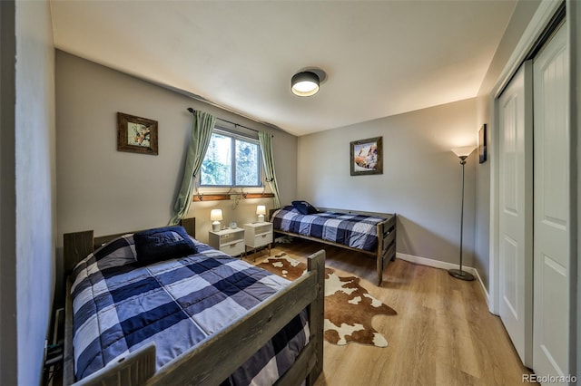 466 Hi Country Dr Unit 109, Winter Park, CO 80482 - bedroom with light wood-style flooring and a closet