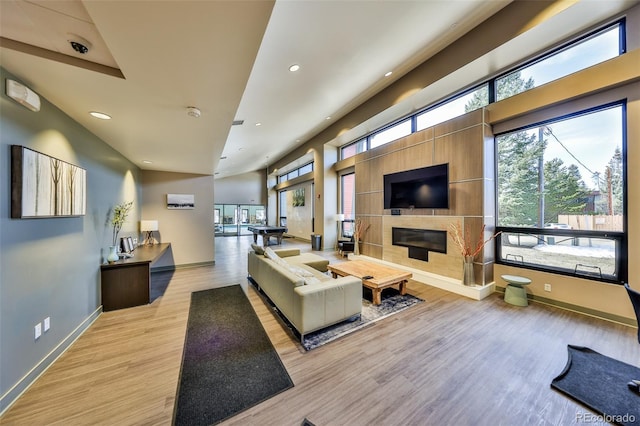 466 Hi Country Dr Unit 109, Winter Park, CO 80482 - living room with a fireplace, wood finished floors, and recessed lighting