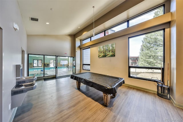 466 Hi Country Dr Unit 109, Winter Park, CO 80482 - recreation room featuring wood finished floors, healthy amount of natural light, a high ceiling, recessed lighting, and billiards table