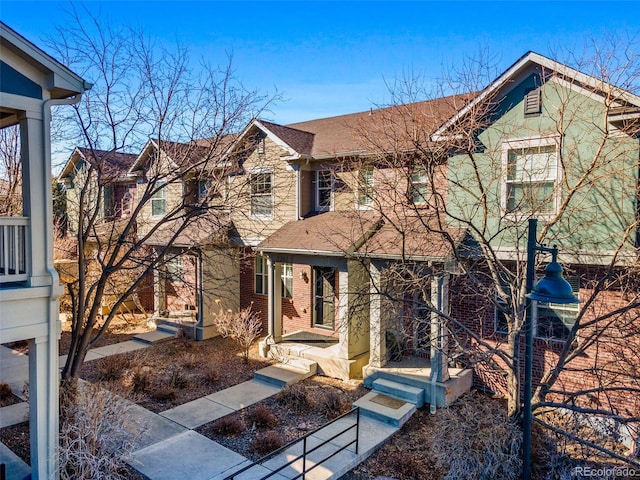 view of front of home featuring brick siding