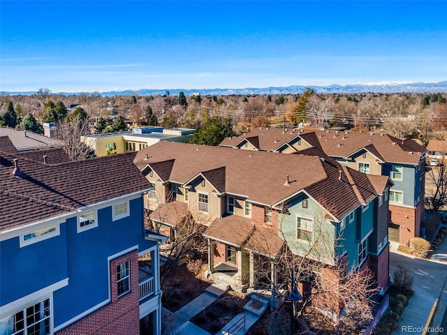 birds eye view of property with a mountain view and a residential view