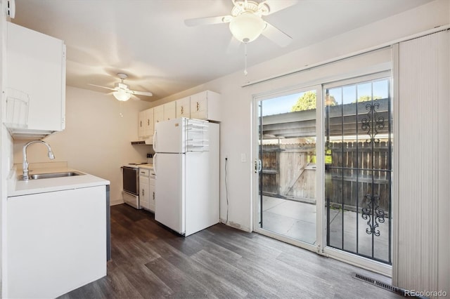 kitchen featuring white cabinetry, electric range, sink, dark wood-type flooring, and white refrigerator