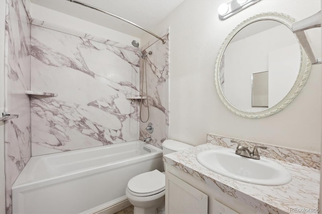 full bathroom with vanity, tiled shower / bath combo, and toilet