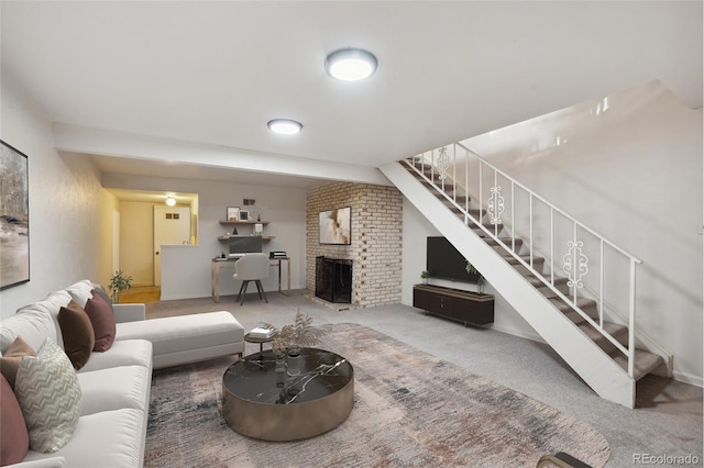 carpeted living room featuring a fireplace