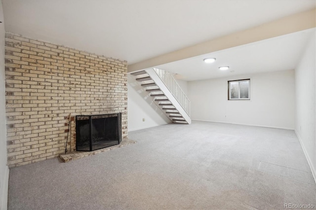 basement featuring carpet floors and a fireplace