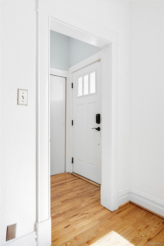 entrance foyer featuring light wood finished floors