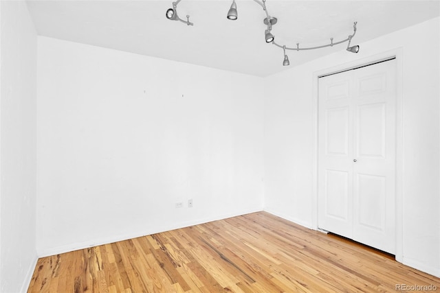 empty room with light wood finished floors