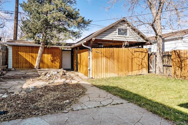 view of front of home featuring fence