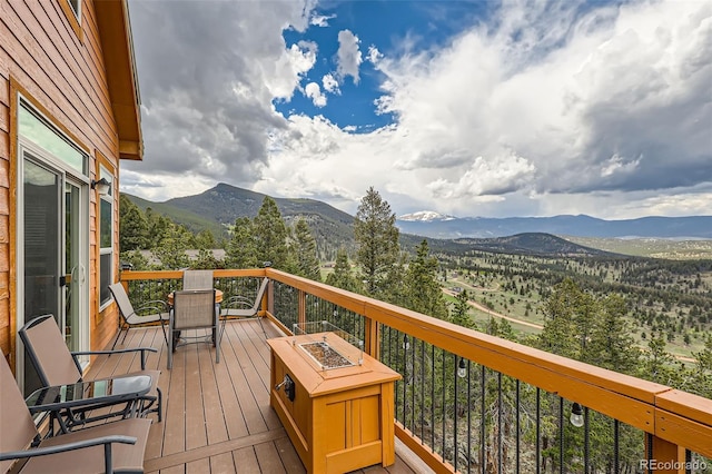 72 Hilltop Dr, Bailey, CO 80421 - wooden deck featuring a mountain view and a fire pit