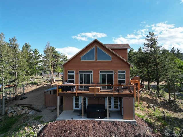 72 Hilltop Dr, Bailey, CO 80421 - rear view of property with french doors, a patio area, a wooden deck, and a hot tub