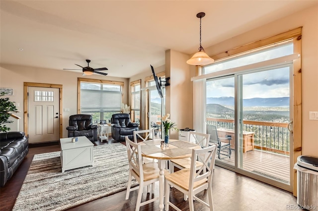 72 Hilltop Dr, Bailey, CO 80421 - dining area featuring ceiling fan, a mountain view, and wood finished floors