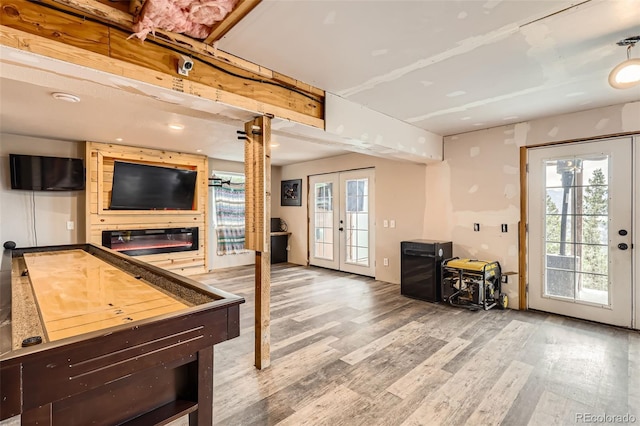 72 Hilltop Dr, Bailey, CO 80421 - game room with french doors, wood finished floors, and plenty of natural light