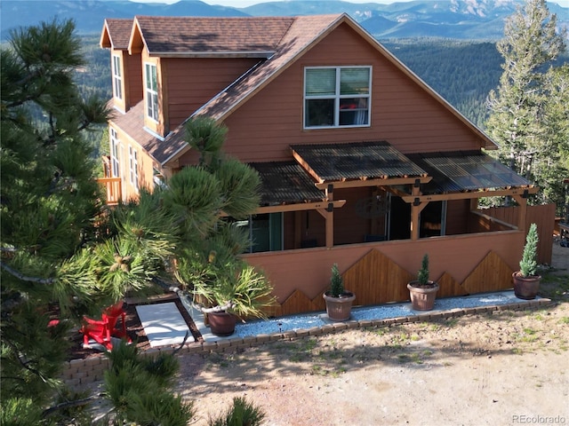 72 Hilltop Dr, Bailey, CO 80421 - view of front facade with a mountain view and a sunroom