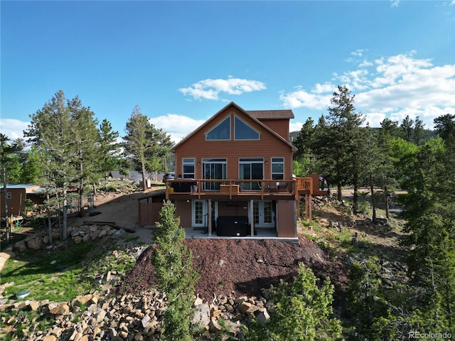 72 Hilltop Dr, Bailey, CO 80421 - back of property featuring a wooden deck and a patio
