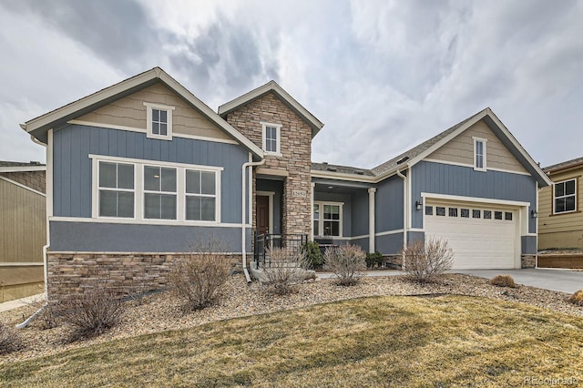 craftsman house featuring a garage, stone siding, and concrete driveway