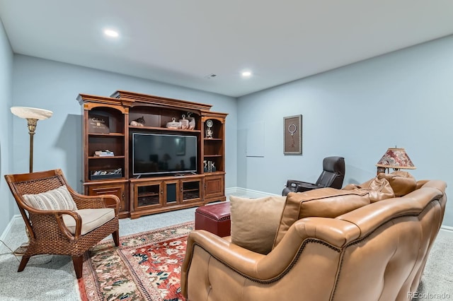 carpeted living room featuring recessed lighting and baseboards