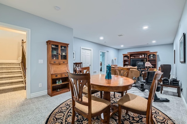 dining room with baseboards, stairway, carpet, and recessed lighting