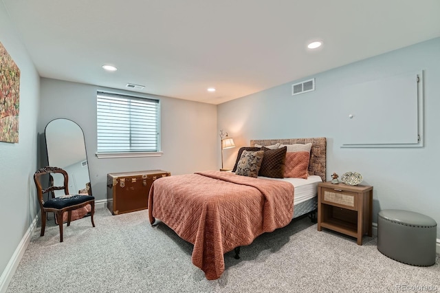 bedroom with recessed lighting, visible vents, and light carpet