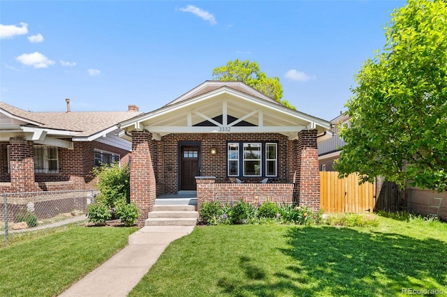 3332 N Vine St, Denver, CO 80205 - view of front of property featuring brick siding, a porch, and a chimney