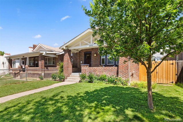 3332 N Vine St, Denver, CO 80205 - english style home featuring a porch, brick siding, and a chimney