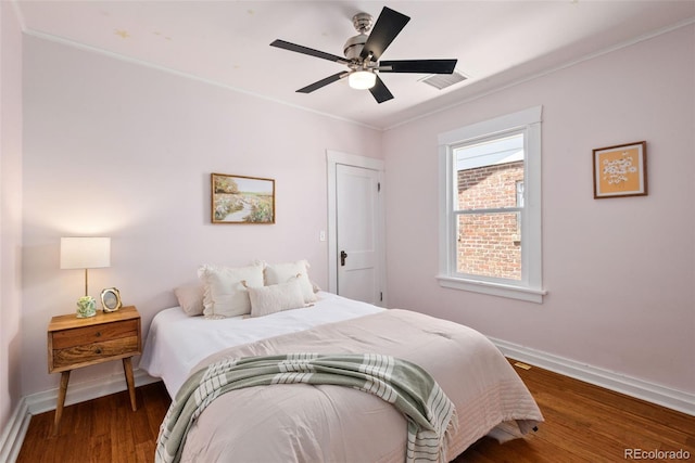 3332 N Vine St, Denver, CO 80205 - bedroom with baseboards, wood finished floors, crown molding, and a ceiling fan
