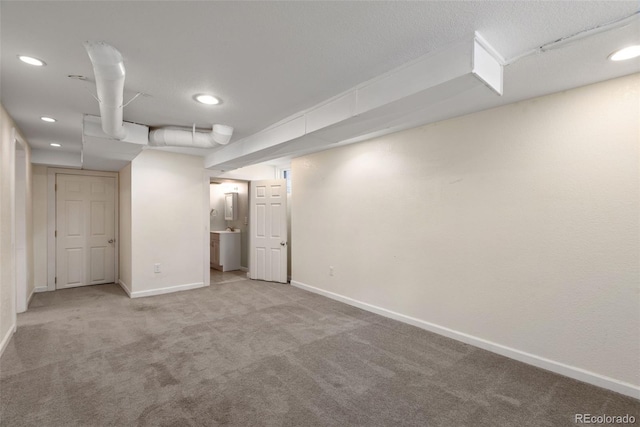 3332 N Vine St, Denver, CO 80205 - finished basement featuring baseboards, carpet, and recessed lighting