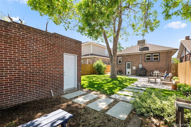 3332 N Vine St, Denver, CO 80205 - back of property with a patio area, brick siding, and central air condition unit
