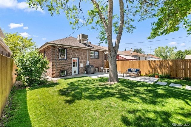 3332 N Vine St, Denver, CO 80205 - rear view of property featuring brick siding and a patio area