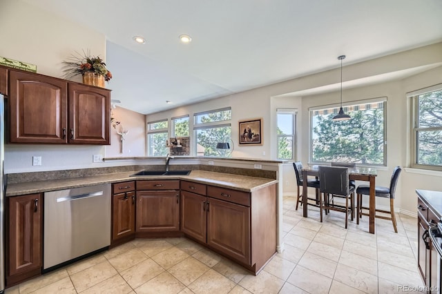 kitchen featuring recessed lighting, dishwasher, light tile patterned floors, a sink, and a peninsula