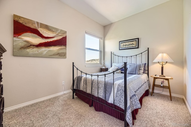 bedroom featuring carpet and baseboards