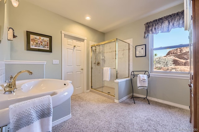bathroom featuring a shower stall, baseboards, and recessed lighting