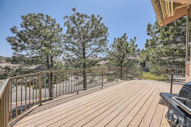 wooden terrace with area for grilling