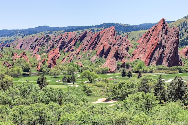 mountain view with a water view and golf course view