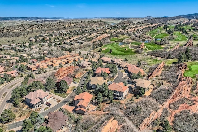 aerial view featuring a residential view, golf course view, and a mountain view