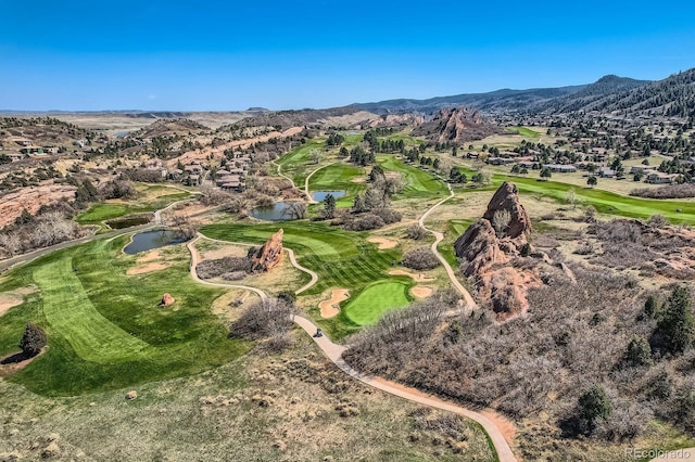 bird's eye view featuring a water and mountain view and view of golf course