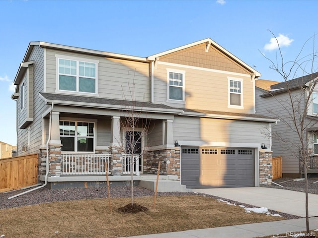 craftsman-style home with covered porch and a garage