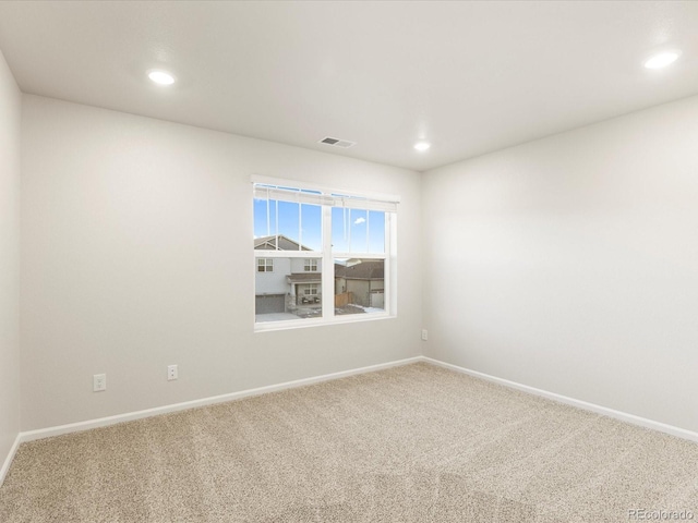 empty room featuring carpet flooring