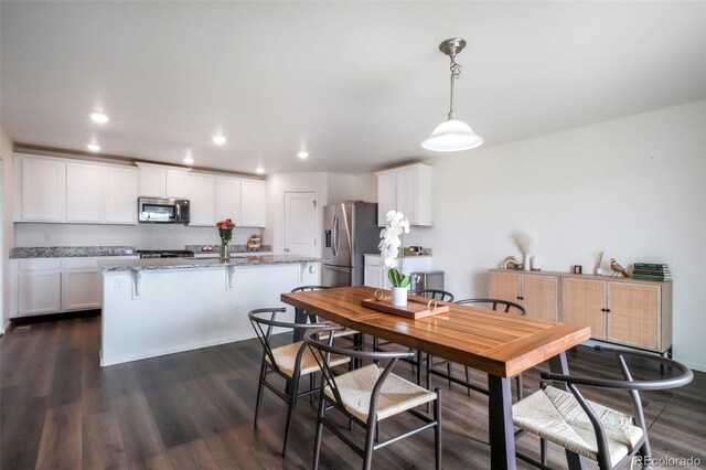 47312 Lilac Ave, Bennett, CO 80102 - dining room with recessed lighting and dark wood-style floors