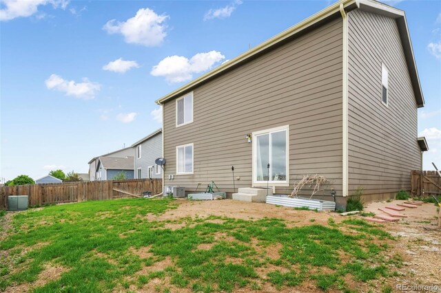 47312 Lilac Ave, Bennett, CO 80102 - back of property with central air condition unit