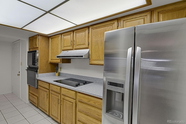 7000 E Quincy Ave Unit 302, Denver, CO 80237 - kitchen featuring black appliances, under cabinet range hood, light countertops, and light tile patterned floors